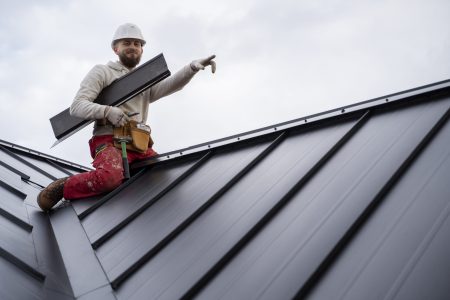 full-shot-smiley-man-working-roof
